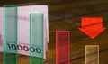 Indonesian Rupiah Currency With Graphic And Red Arrow Sign