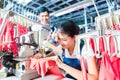 Indonesian Seamstress in Asian textile factory Royalty Free Stock Photo