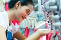 Indonesian Seamstress in Asian textile factory Royalty Free Stock Photo