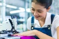 Indonesian seamstress in a textile factory