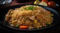 Indonesian simple chicken fried rice on the plate, some white crackers as garnish, freshly cooked, appetizing, delicious food