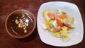 Indonesian spicy fruit salad 'Rujak' with peanut sauce