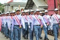 Indonesian students walking and marching on the street using uniforms in celebrating the country's Independence Day