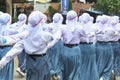 Indonesian students walking and marching on the street using uniforms in celebrating the country's Independence Day