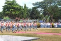 Indonesian students walking and marching on the street using uniforms in celebrating the country's Independence Day