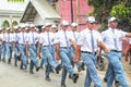 Indonesian students walking and marching on the street using uniforms in celebrating the country's Independence Day