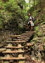 Tourist on wooden ladders in Slovak Paradise Royalty Free Stock Photo