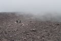 Indonesian tourists in the clouds on Vilcano Merapi