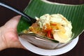 Indonesian traditional food nasi ayam semarang, chicken rice with shredded fried chicken, chayote, egg and coconut sauce