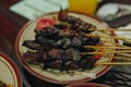 Indonesian traditional goat satay or mutton satay dish served on a plate Royalty Free Stock Photo