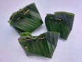 Indonesian traditional steamed cake made from cassava and Javanese sugar wrapped in banana leaves.