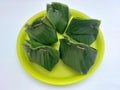 Indonesian traditional steamed cake made from cassava and Javanese sugar wrapped in banana leaves.