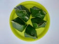 Indonesian traditional steamed cake made from cassava and Javanese sugar wrapped in banana leaves.