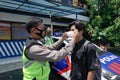 The Indonesian traffic police carry out disciplinary operations on the COVID-19