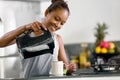 Indonesian woman making coffee