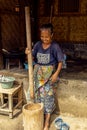 Indonesian woman making coffee in the old traditional way