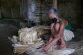 Indonesian woman making traditional bamboo cantainer