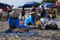 Indonesian women massage girls to tourists on the beach on Bali, Indonesia