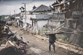 Worker walking in village