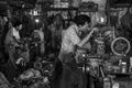 Indonesian workers operate their machines in an old workshop