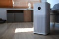 Air purifier on wooden floor in living room for filter and cleaning removing dust PM2.5 and virus.