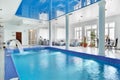 Indoor big blue swimming pool interior Royalty Free Stock Photo