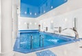 Indoor big blue swimming pool interior