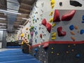 Indoor bouldering and climbing wall for training at a modern gym Royalty Free Stock Photo