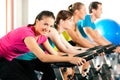 Indoor bycicle cycling in gym Royalty Free Stock Photo