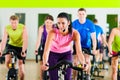 Indoor bycicle cycling in gym Royalty Free Stock Photo