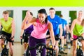 Indoor bycicle cycling in gym Royalty Free Stock Photo