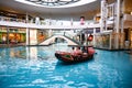 Indoor canal with antique sampan boat at Shopping Mall `The Shoppes` in Marina Bay Sands Complex, Singapore Royalty Free Stock Photo