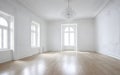 Indoor interior empty white room by shining bright sunlight from the window Royalty Free Stock Photo