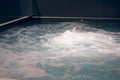 Indoor jacuzzi pool with boiling water at the spa center Royalty Free Stock Photo