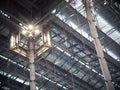 Indoor modern contemporary complex steel wall and roof construction structure inside a large building with bright illumination hig Royalty Free Stock Photo