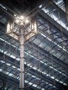 Indoor modern contemporary complex steel wall and roof construction structure inside a large building with bright illumination hig Royalty Free Stock Photo