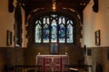 Indoor photo of a small church with lead glass windows and altar Royalty Free Stock Photo