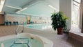 Indoor pool and jacuzzi in the partment building. Dolly shot