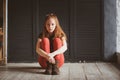 Indoor portrait of beautiful young redhead woman Royalty Free Stock Photo