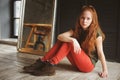 Indoor portrait of beautiful young redhead woman Royalty Free Stock Photo