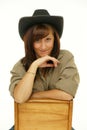 Indoor portrait of beautiful young woman cowgirl