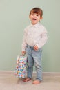 Indoor portrait of cute happy baby girl playing with easter decorations Royalty Free Stock Photo