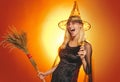 Indoor portrait of cute young witch at halloween party. Glamour Fashion Sexy Vampire Lady with witch costume. Beauty Royalty Free Stock Photo