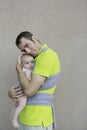 Indoor portrait of young father hugging his little daughter Royalty Free Stock Photo