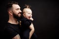 Indoor portrait of young father hugging his little daughter Royalty Free Stock Photo