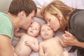 indoor portrait of young happy smiling mother and father with twin babies at home Royalty Free Stock Photo