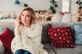 Indoor portrait of young selfish beautiful woman enjoying time at home
