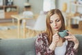 Indoor portrait of young thoughtful woman relaxing at home Royalty Free Stock Photo