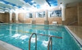 Indoor public swimming pool interior in fitness gym club Royalty Free Stock Photo