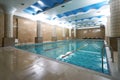 Indoor public swimming pool interior in fitness gym club Royalty Free Stock Photo